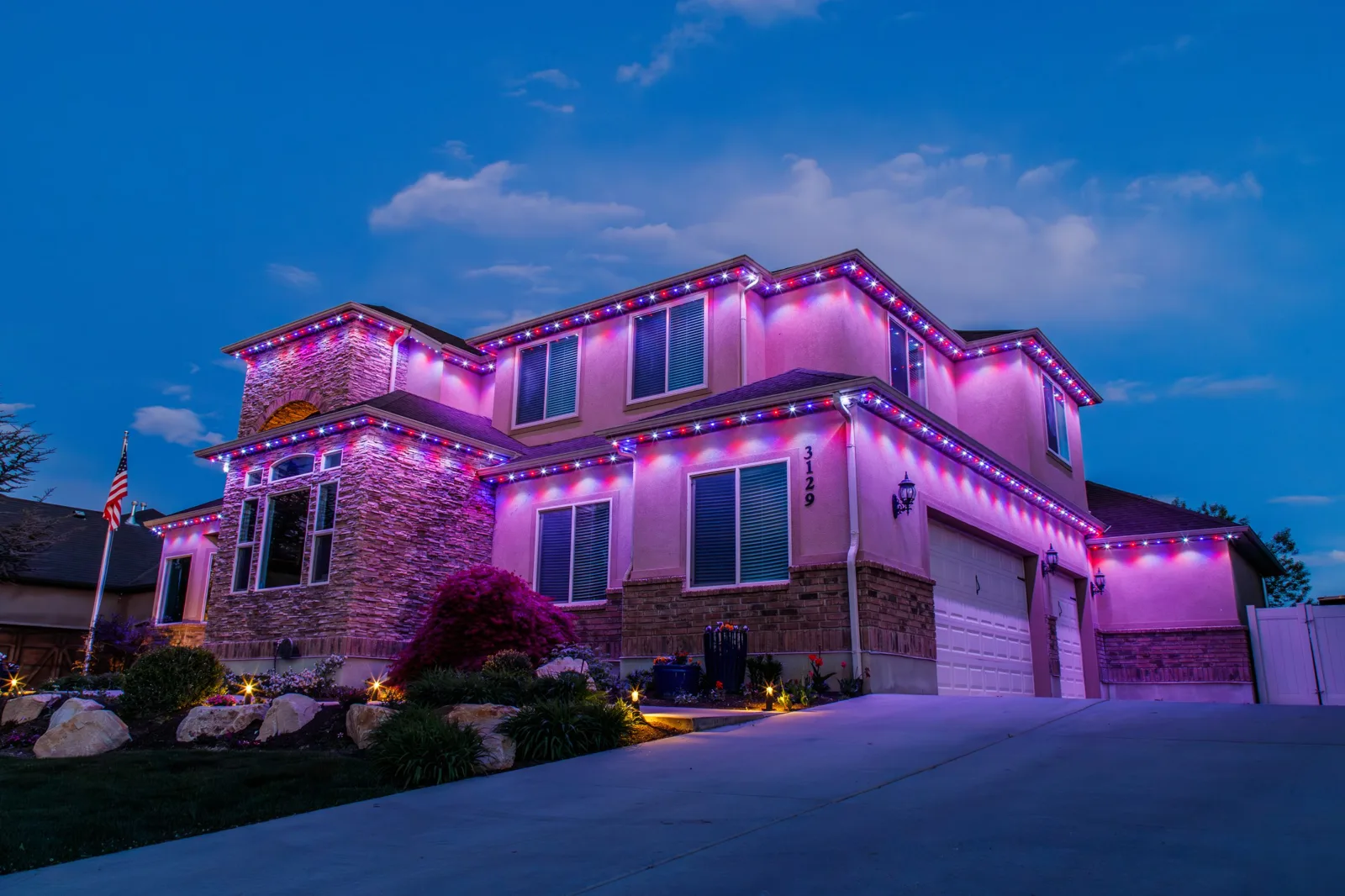 Home with purple Christmas uplighting